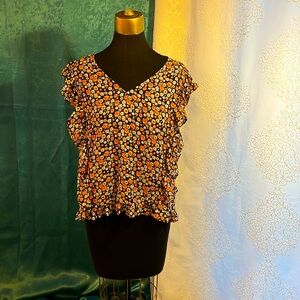 Madison Jules orange and blue ruffle front blouse with ruffle hem.